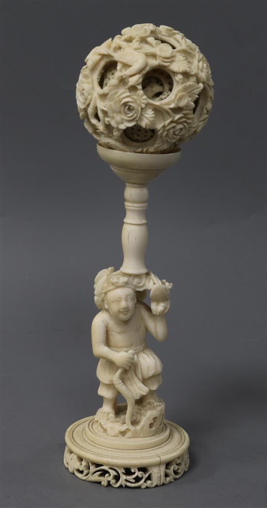 A Chinese ivory concentric ball on stand